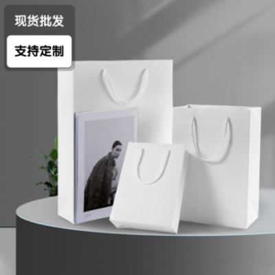 现货批发购物公司宣传广告白卡纸袋 白卡纸男女服装礼品手提纸袋